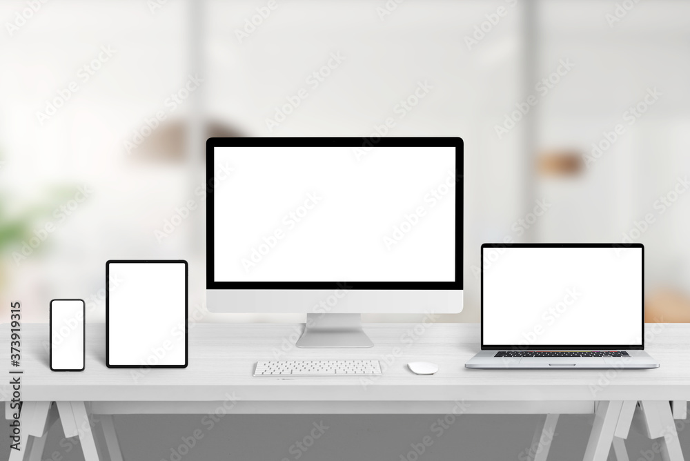 Poster computer display, laptop, tablet and smart phone on office desk with isolated display for web site, 