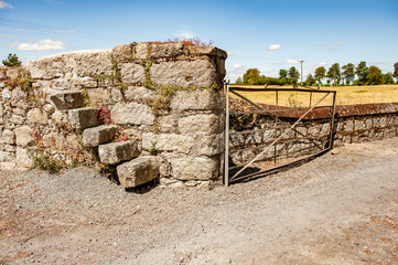 19th Century Wall and Granite Steps and Wrought Iron Gate Entrance.