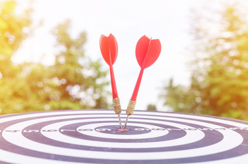 Bullseye is a target of business concept. business marketing as concept.Dartboard is the target and...