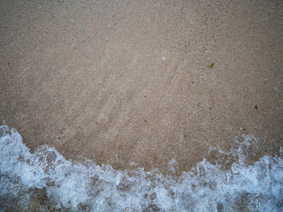 The strong wave at the beach and sand at Koh Tao, Thailand