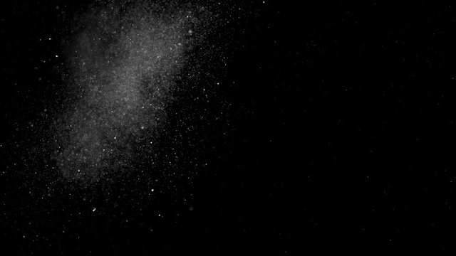 Dust particles sparkling on black background with mist sprinkling effect