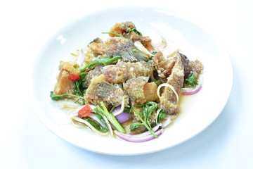 deep fried slice snake skin gourami spicy and sour Thai salad on dish