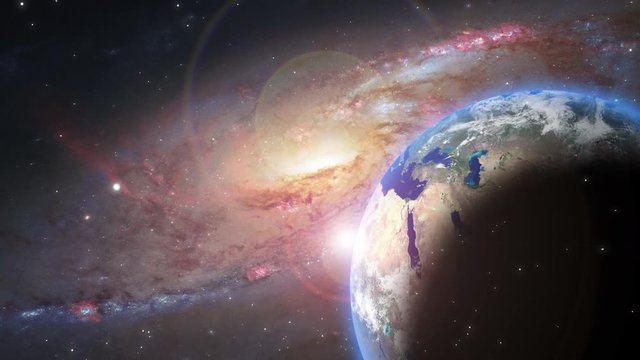 Video of universe or aerial flyby. Camera moves towards hand holding planet earth while stars flyby. Apt for motivational, meditation, intro or opener, music and spiritual videos.