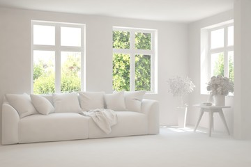 White living room with sofa and summer landscape in window. Scandinavian interior design. 3D illustration