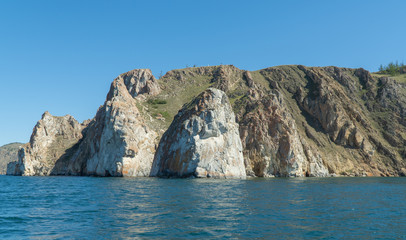 Fototapeta na wymiar Cape Sagan-Khushun, rocky coast. called as the Cape Three brothers. Three stone peaks symbolizing the three brothers