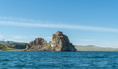 Fototapeta na wymiar Shamanka Rock on Olkhon. Cape Burhan. Beautiful landscape of Siberian Baikal Lake. concept of travel.