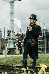 Young man weared in steampunk style