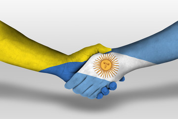 Handshake between argentina and ukraine flags painted on hands, illustration with clipping path.