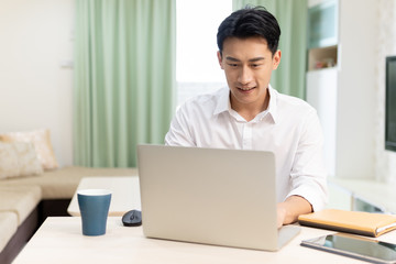 Asian man work at home