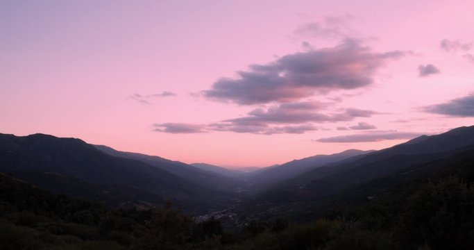 
Timelapse during a sunset of the clouds between the mountains in the Valle del Jerte, C&aacute;ceres, Spain. Dramatic skies and nature