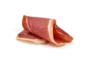 Italian prosciutto crudo or spanish jamon. Jerked ham, isolated on white background