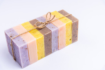 Natural handmade soap bars with herbal, flowers, essential oils. Homemade beauty products with organic ingredients. Spa organic soap closeup. Copy space