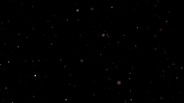 Dust particles sparkling on black background with white light bokeh effect