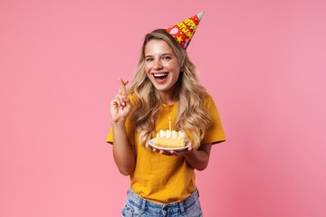 Birthday woman showing fingers crossed gesture