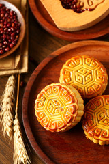 Chinese traditional mid autumn festival moon cake in wooden plate