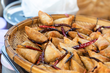 Myanmar street food fried wheat flour curry dumpling potatoes snuffing sprinkle with chili oil