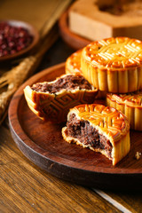 Chinese traditional mid autumn festival moon cake in wooden plate