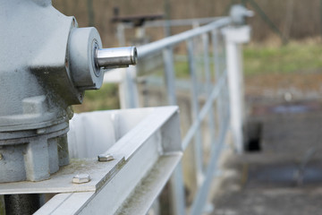 Fototapeta na wymiar Metal water dam valve close-up