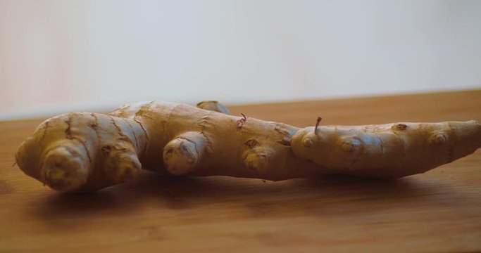 Ginger Close Up. Healthy Vegetable Spinning On Plate in Kitchen