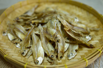 Dried anchovies in the bamboo wicker are a great food preserve