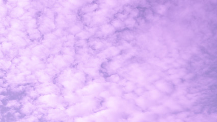 Blur purple clouds sky as abstract background. Violet fluffy cloudscape texture.