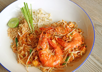 Closeup a Plate of Pad Thai or Thai Style Fried Noodle Topped with River Prawns