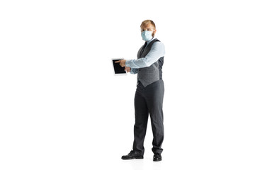 Cheerful handsome businessman isolated over white studio background, copyspace. Modern young director, manager in office suit, full length portrait. Using devices, gadgets. Business, finance, tech