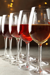 Glasses of wine against background with blurred lights