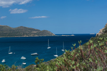 Fototapeta na wymiar Panoramic view of a beautiful bay with yachts, blue water and old tower