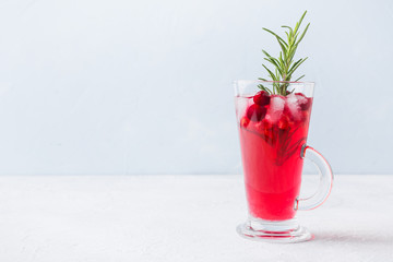 Pomegranate Christmas cocktail with rosemary, champagne, club soda.
