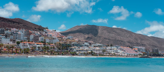 Panoramic view of the tropical Playa de Las Vistas, one of the most popular beaches in the south of the island with friendly waves and fine sand, nearby Los Cristianos, Tenerife, Canary Islands, Spain