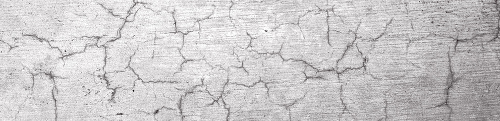 The texture of the old gray cracked concrete wall
