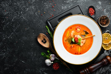 Tomato soup with seafood: shrimp and mussels. Top view. Free space for text.