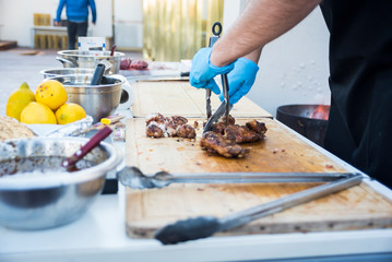 man preparing food outdoors