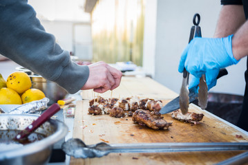 man preparing food on the grill