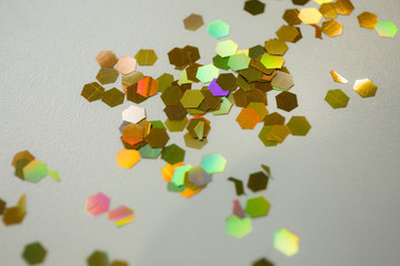 golden candy on white background macro shot with copy space. Christmas background for advertising or postcard