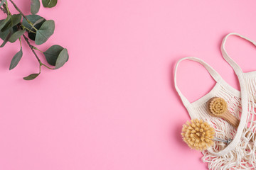 Eco-friendly kitchen accessories on pink background. The concept zero waste and our planet.