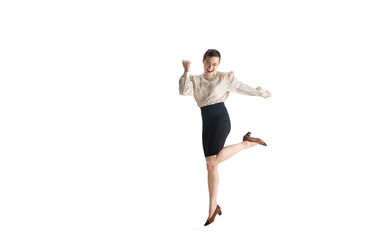 Beautiful business woman, secretary, manager on white studio background. Beautiful caucasian female model in office attire. Copyspace for ad, Concept of business, finance, occupation. Dancing, jumping