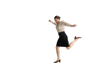 Obraz premium Beautiful business woman, secretary, manager on white studio background. Beautiful caucasian female model in office attire. Copyspace for ad, Concept of business, finance, occupation. Dancing, jumping