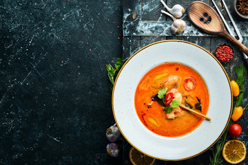 Tomato soup with seafood: shrimp and mussels. Top view. Free space for text.