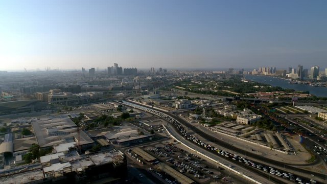 Panning right all the way from Oud Metha onto a view of Al Maktoum Bridge and beyond the Dubai Creek, Aerial, 6-axis stabilized gimbal, Shotover F1, 8K, parallax.