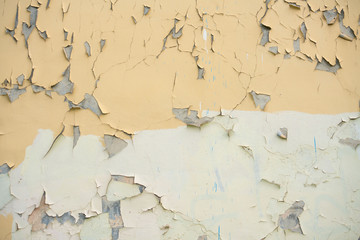 Fototapeta premium wall with yellow old peeling paint