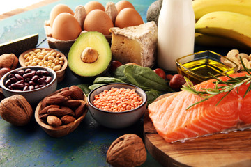 Selection of healthy food for heart, life concept with eggs and avocado on background