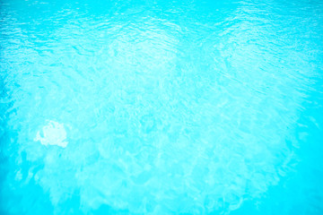 Fototapeta na wymiar Surface of blue swimming pool. Background of water in swimming pool