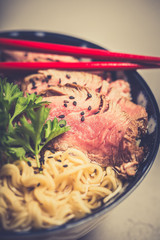 Ramen Soup with Wagyu Beef Filet on Bowl on wooden table. Beef ramen served in Asian style