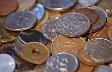 Pile of world coins with macro