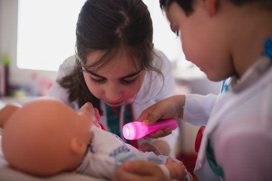 Two children playing medics at home