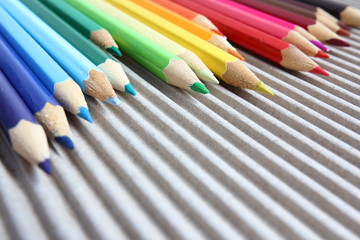Color pencils on brown corrugated cardboard - close-up