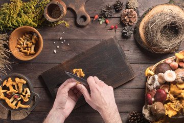 Autumn harvest of mushrooms on vintage rustic wooden background. Rustic kitchen table. Flat lay top, top view . Layout with free text space. Forest harvest concept.