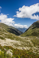 Fototapeta na wymiar Alpine meadows and rocks in the Caucasus mountains in Russia